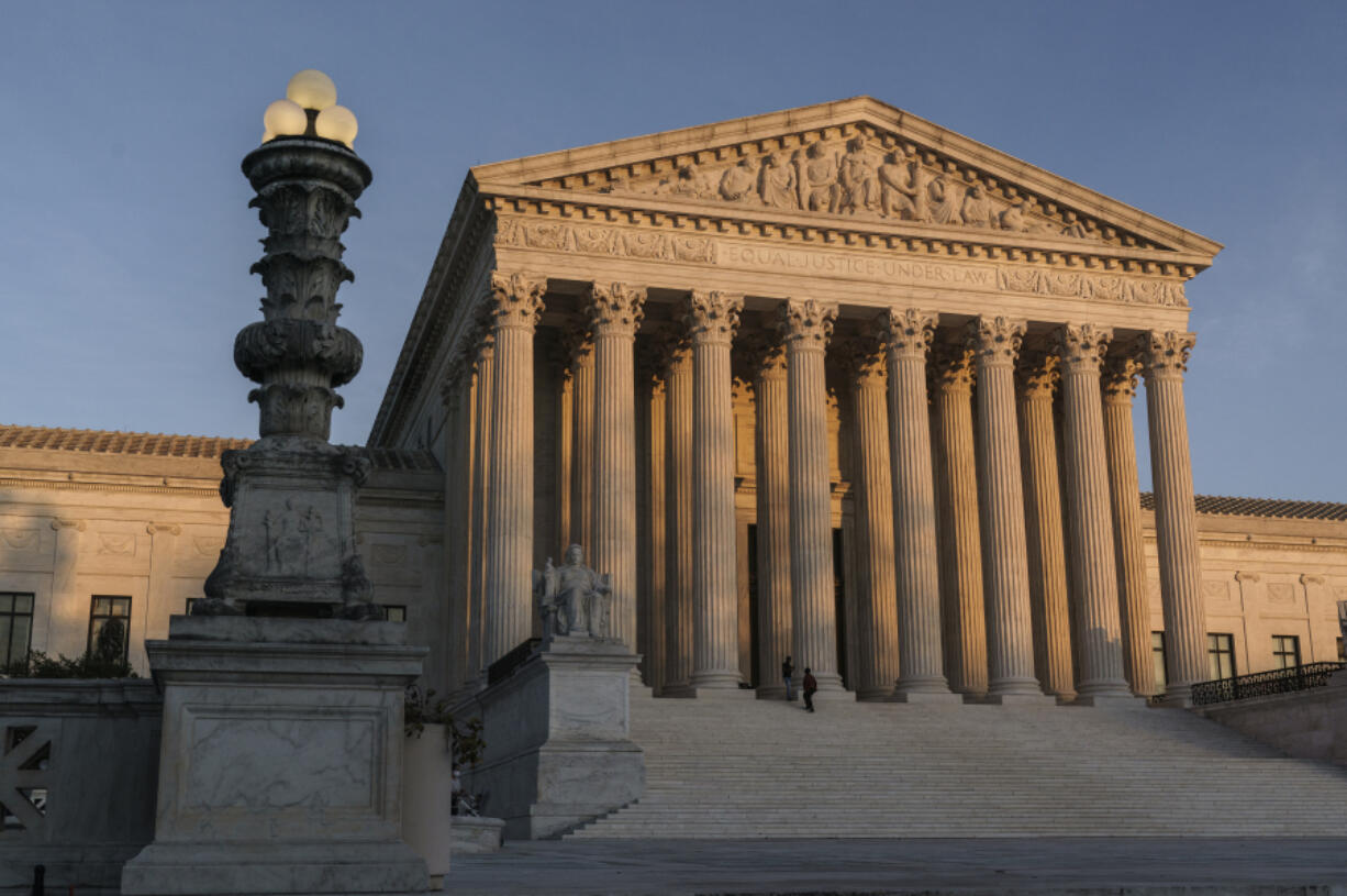 FILE - The Supreme Court is seen at sundown in Washington, on Nov. 6, 2020. The Supreme Court avoided a catastrophic accident in 2022 when a massive piece of marble at least two feet in length crashed to the ground in an interior courtyard used by the justices and their aides. (AP Photo/J.