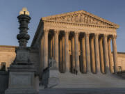 FILE - The Supreme Court is seen at sundown in Washington, on Nov. 6, 2020. The Supreme Court avoided a catastrophic accident in 2022 when a massive piece of marble at least two feet in length crashed to the ground in an interior courtyard used by the justices and their aides. (AP Photo/J.