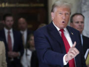 Former President Donald Trump speaks to reporters as he leaves the courtroom during a lunch break in his civil business fraud trial, Oct. 4, 2023, in New York. Trump's lawyers have asked a judge to postpone his Florida classified documents trial until after next year's presidential election. The lawyers say they have not received all the records they need to prepare Trump's defense.