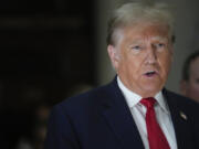 FILE - Former President Donald Trump, speaks to reporters as he leaves the courtroom during a lunch break in his civil business fraud trial, Oct. 4, 2023, in New York. Trump's lawyers have asked a judge to postpone his Florida classified documents trial until after next year's presidential election. The lawyers say they have not received all the records they need to prepare Trump's defense.