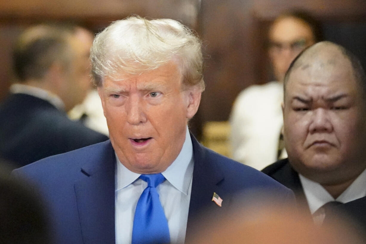 Former President Donald Trump, center, arrives at New York Supreme Court, Monday, Oct. 2, 2023, in New York. Trump is making a rare, voluntary trip to court in New York for the start of a civil trial in a lawsuit that already has resulted in a judge ruling that he committed fraud in his business dealings.