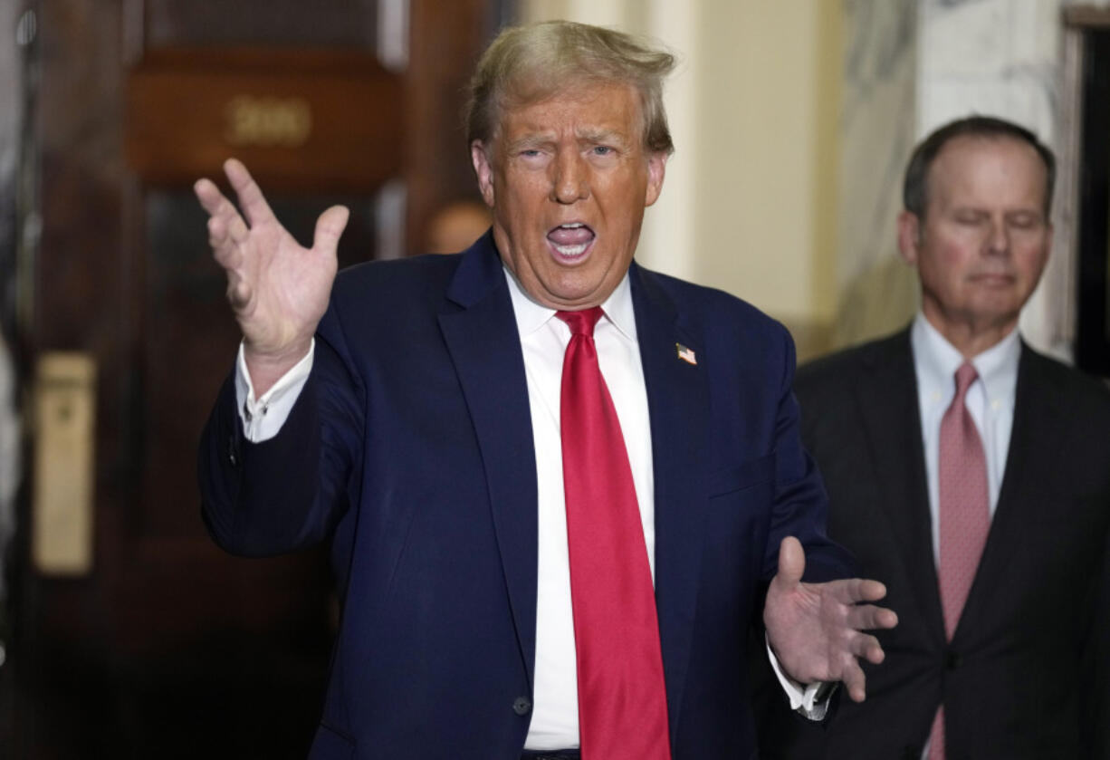 Former President Donald Trump arrives for his civil business fraud trial at New York Supreme Court, Tuesday, Oct. 17, 2023, in New York.