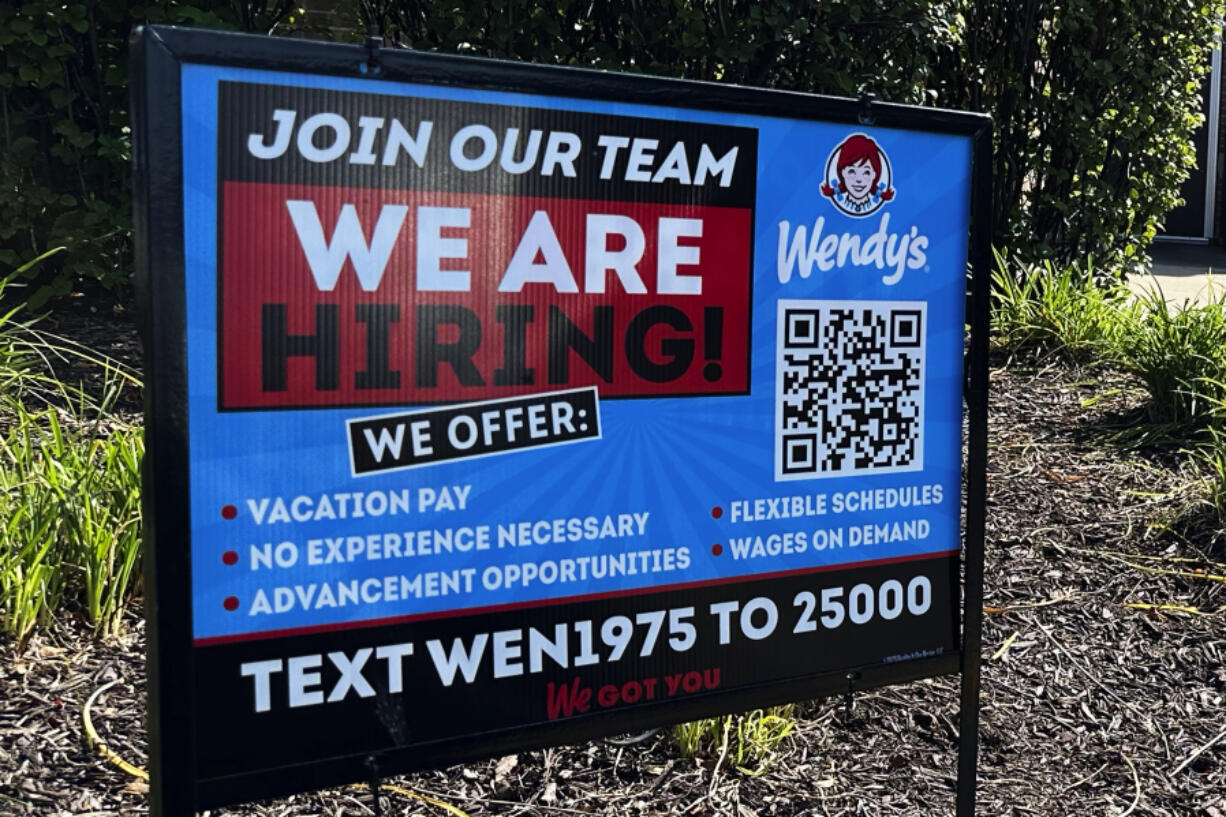 A hiring sign is displayed at a restaurant in Buffalo Grove, Ill., Saturday, Sept. 23, 2023. On Thursday, the Labor Department reports on the number of people who applied for unemployment benefits last week. (AP Photo/Nam Y.