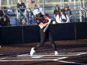 Union's Sophia Rickard connects on a pitch during the Titans' 15-11 win over Skyview in the 4A district slowpitch softball championship game at Heritage High School on Thursday, Oct. 19, 2023.