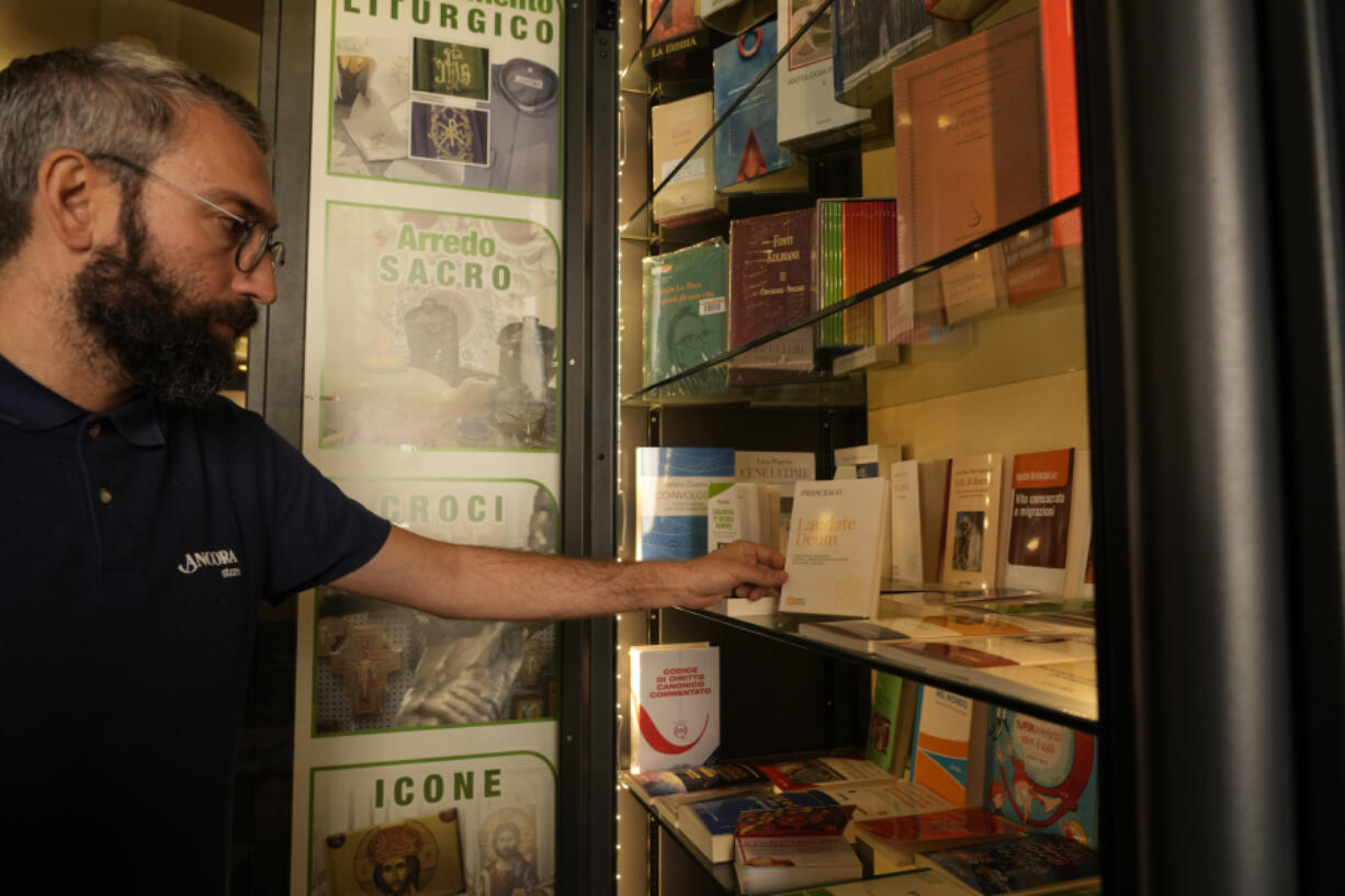 Copies of Pope Francis' latest encyclical letter on environment "Laudate Deum" are prepared for sale in a bookshop in Rome, Wednesday, Oct. 4, 2023.