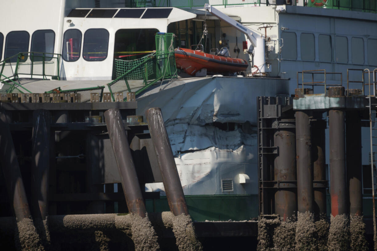 FILE - A damaged Cathlamet ferry sits at the Fauntleroy dock in West Seattle, July 28, 2022. Fatigue and complacency led to the passenger and car ferry crashing into a terminal in Seattle last year, causing $10.3 million in damage to the ferry, according to the National Transportation Safety Board's final report released on Thursday, Oct. 12, 2023.