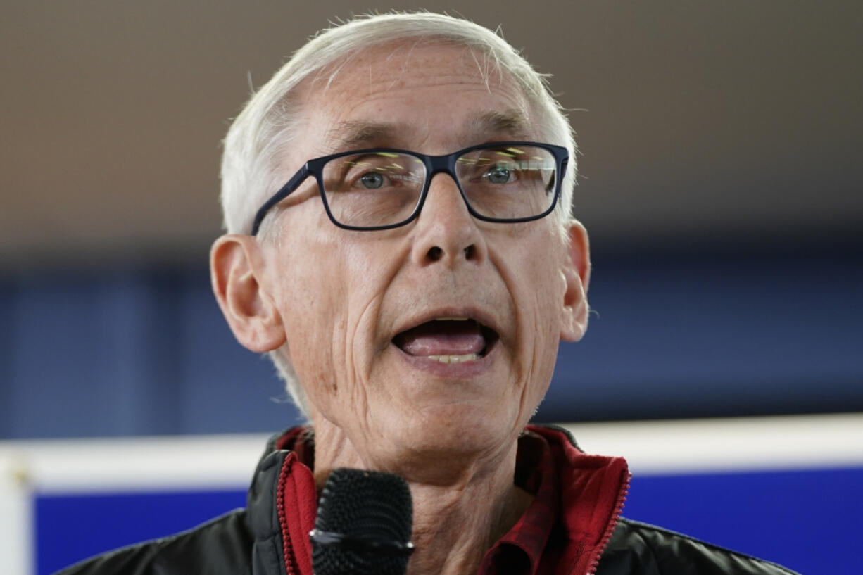 FILE - Wisconsin Democratic Gov. Tony Evers speaks at a campaign stop, Oct. 27, 2022, in Milwaukee. Evers is suing the Republican-controlled Legislature, Tuesday, Oct. 31, 2023, arguing that it is obstructing basic government functions, including signing off on pay raises for university employees that were previously approved.