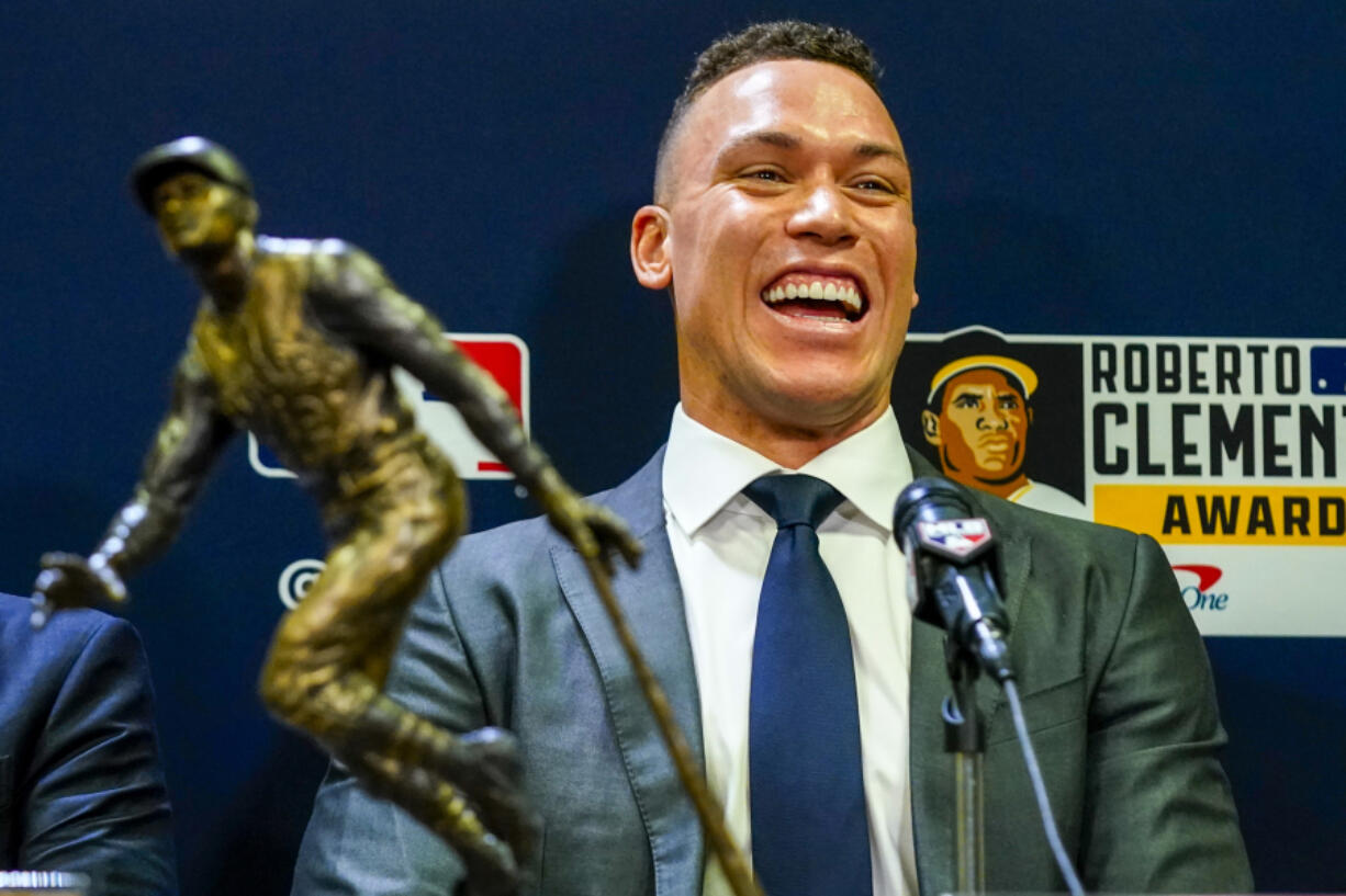 New York Yankees' Aaron Judge smiles after he was named the 2023 Recipient of the Roberto Clemente Award before Game 3 of the baseball World Series between the Arizona Diamondbacks and the Texas Rangers Monday, Oct. 30, 2023, in Phoenix. (AP Photo/Ross D.