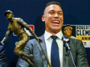 New York Yankees' Aaron Judge smiles after he was named the 2023 Recipient of the Roberto Clemente Award before Game 3 of the baseball World Series between the Arizona Diamondbacks and the Texas Rangers Monday, Oct. 30, 2023, in Phoenix. (AP Photo/Ross D.