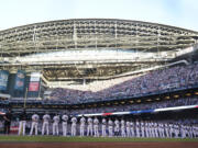 The Arizona Diamondbacks line up for Game 3 of the baseball World Series against the Texas Rangers Monday, Oct. 30, 2023, in Phoenix. (AP Photo/Godofredo A.