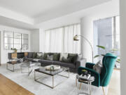 Green is repeated and used to create a cohesive color theme in this living space.