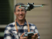 John Veneruso flies a drone at his home in the Felida neighborhood north of Vancouver city limits. The hobbyist is careful to comply with Federal Aviation Administration regulations.