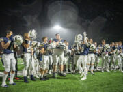 The Seton Catholic football team celebrates their playoff win against Tenino on Friday, Nov. 3, 2023, at Seton Catholic High School. It was Seton’s first home playoff game.