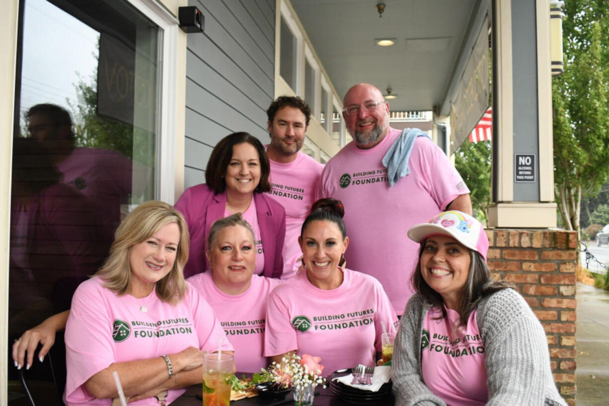 Members of the nonprofit Building Futures Foundation pose for a photo. The foundation supports people starting careers in the building industry.