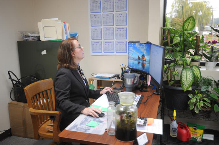 Sen. Ann Rivers works in her office in Longview, where she serves as assistant city manager. Rivers said juggling the demands of a full-time job and serving as a state legislator can be challenging, but also rewarding.