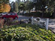 The sign for Cougar Creek Apartments is pictured in Hazel Dell.