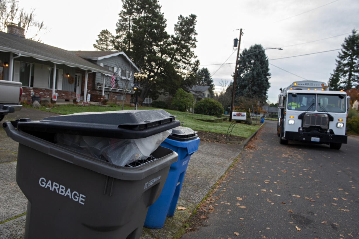 Allen Morseman, residential recycle route driver for Waste Connections of Washington, makes the rounds in Hazel Dell every Tuesday morning. Dates for pickups, as well as rates and services for garbage and recycling, can vary depending on where in the county you live.