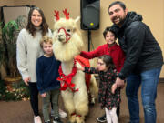 Stacy Abdollmohammadi poses with her family and a llama at Special Celebration&rsquo;s Sensitive Santa event, which her family has attend for four years.