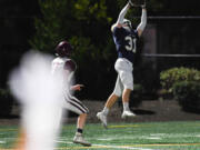 Seton Catholic senior Ryan Stuck catches a touchdown pass Friday, Sept. 22, 2023, during the Cougars? 59-0 win against Stevenson at Seton Catholic High School.