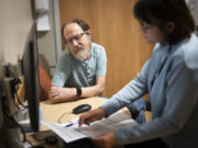 Dr. Laura LaFave chats with patient Mark Harris of Hopkins, Minnesota, about his glucose sensor results, which were recorded over time with equipment he wears 24 hours a day, during a routine appointment at the diabetes clinic at Hennepin Healthcare Clinic on Tuesday, Oct. 10, 2023 in Minneapolis.