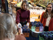 Sisters Christina Dorr Drake, left, and Elena Dorr Zienda share samples of Willa&rsquo;s Oat Milk at Lunds &amp; Byerly&rsquo;s in Minneapolis on Thursday, Oct. 19, 2023. (Shari L.