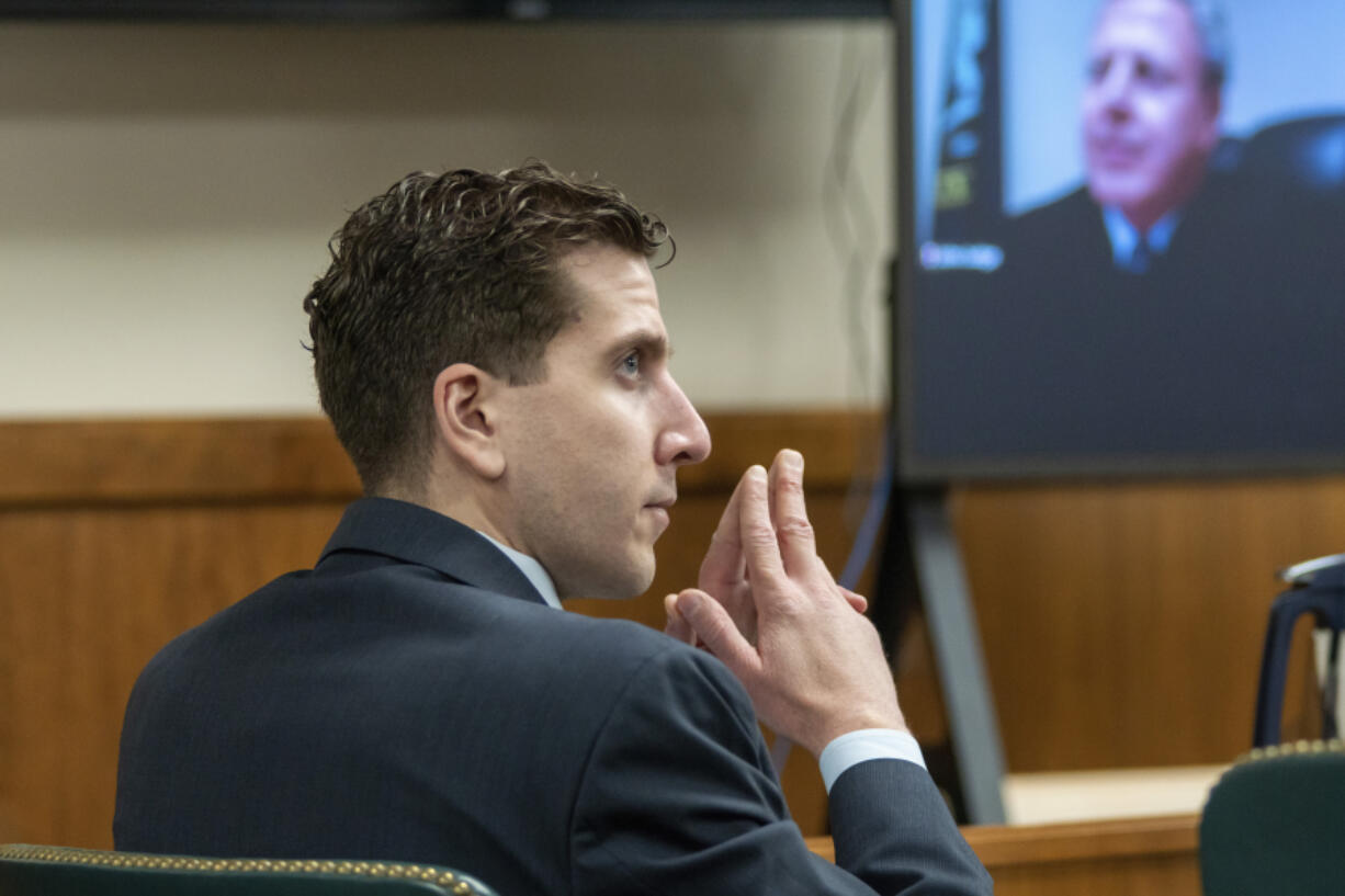 Slaying suspect Bryan Kohberger listens to arguments during a hearing Oct. 26 in Moscow, Idaho. He is charged with four counts of murder in connection with the deaths of four University of Idaho students.