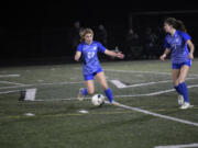 Madisen Newbury (22) of La Center gives instructions to teammate Riley Schultz (7) during the Wildcats&iacute; 3-2 win over Meridian of Bellingham in a Class 1A girls soccer state tournament first-round match at Woodland High School on Wednesday, Nov. 8, 2023.