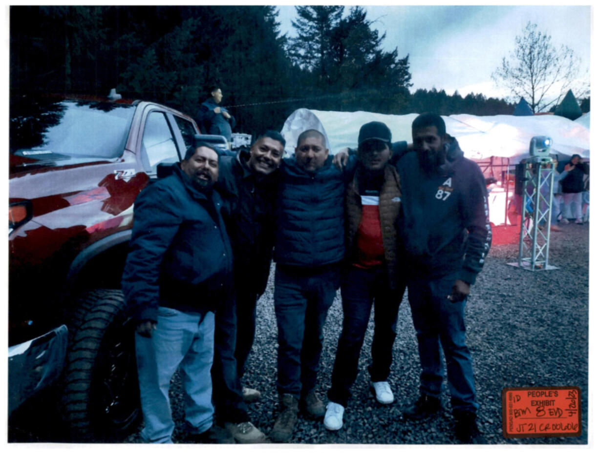 Celebrants at a fateful baptism party include Gadiel Ortega (far left), Ulises Ayala (far right).