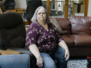 Jeanette Landin sits where she used to sit with her mother at her home in Brattleboro, Vermont.