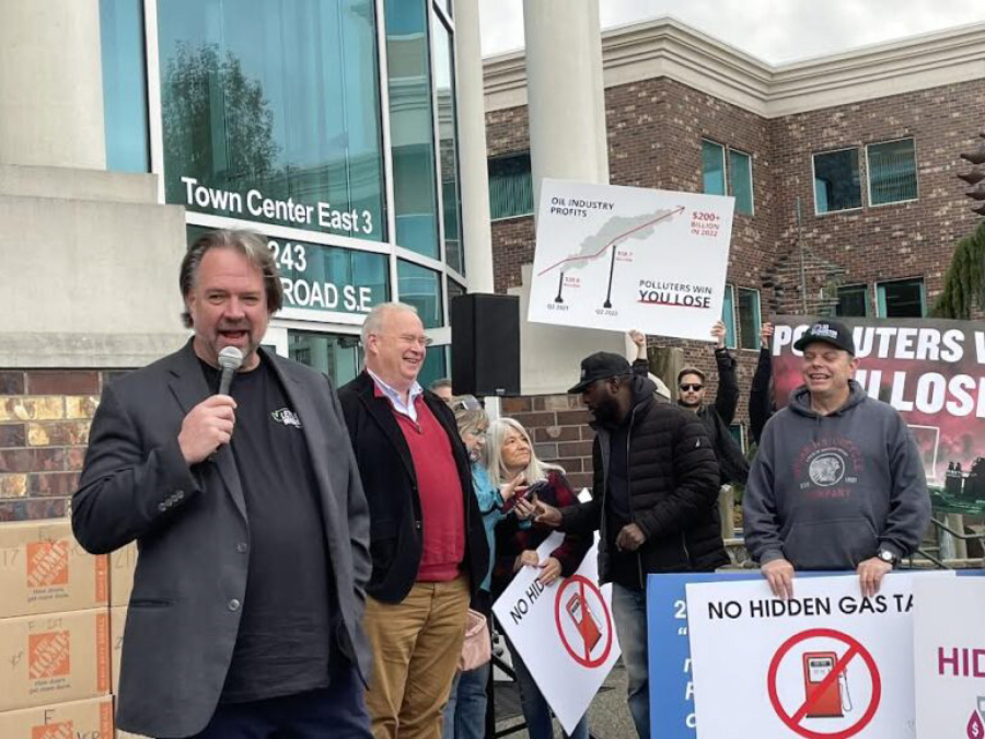 Brian Heywood, from left, founder of Let&rsquo;s Go Washington, stands Tuesday with Washington State Republican Party Chair Jim Walsh in front of boxes of petitions for an initiative to repeal Washington&rsquo;s cap-and invest program.