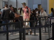 Travelers queue up at the security screening line at O&rsquo;Hare International Airport in Terminal 1 on May 26, 2022.