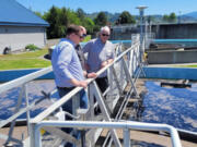 Gary Rowe, the Washington Public Works Board&rsquo;s vice chair, and state Rep. Kevin Waters, R-Stevenson, visit the city of Washougal&rsquo;s wastewater treatment plant earlier this year.