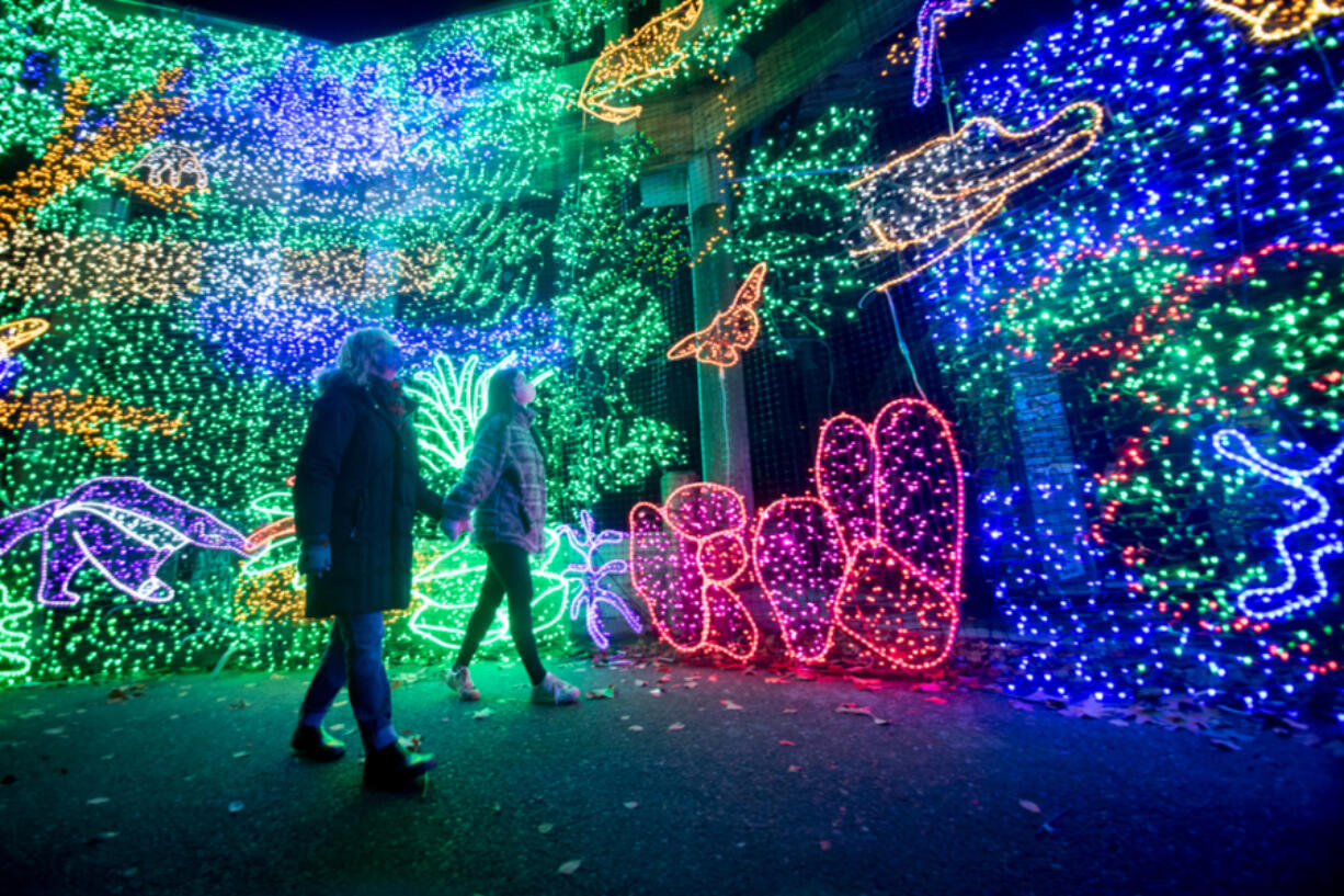 Visitors explore Zoo Lights at the Oregon Zoo.