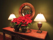 Poinsettias are available in a variety of colors including white, pink, hot pink, yellow, peach, marbled and speckled.