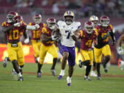 Washington running back Dillon Johnson (7) runs for a touchdown during the first half of an NCAA college football game against Southern California Saturday, Nov. 4, 2023, in Los Angeles.