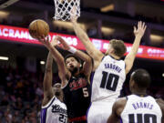 Portland Trail Blazers guard Skylar Mays (5) shoots against Sacramento Kings forward Domantas Sabonis (10) during the first half of an NBA basketball game in Sacramento, Calif, Wednesday, Nov. 8, 2023.