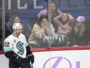 Seattle Kraken right wing Oliver Bjorkstrand celebrates after scoring the go-ahead goal against the Colorado Avalanche as fans react during the third period of an NHL hockey game Thursday, Nov. 9, 2023, in Denver.