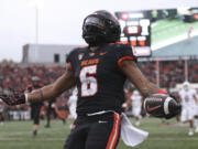 Oregon State running back Damien Martinez (6) celebrates after scoring a touchdown against Stanford during the first half of an NCAA college football game Saturday, Nov. 11, 2023, in Corvallis, Ore.