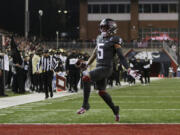 Washington State wide receiver Lincoln Victor runs for a touchdown against Colorado during the first half of an NCAA college football game Friday, Nov. 17, 2023, in Pullman, Wash.