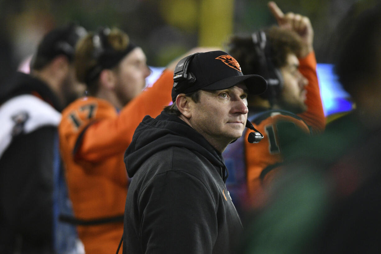 Oregon State coach Jonathan Smith looks up at the scoreboard during the second half of the team's NCAA college football game against Oregon on Friday, Nov. 24, 2023, in Eugene, Ore.