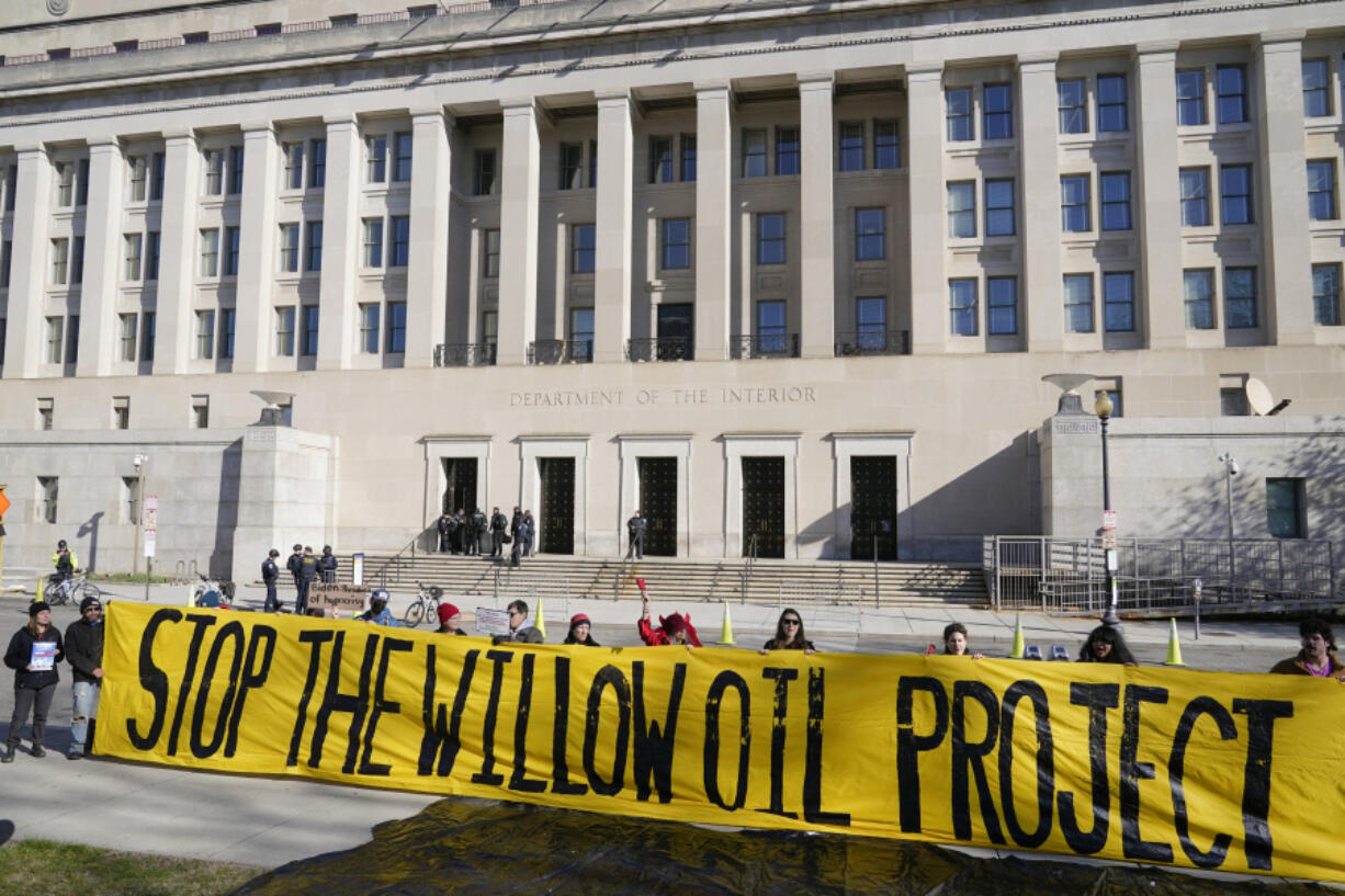 FILE - Demonstrators protest against the Biden administration&rsquo;s approval of the Willow oil-drilling project before a scheduled speech by Biden at the Department of the Interior in Washington, March 21, 2023. A federal judge on Thursday, Nov. 9 upheld the Biden administration&rsquo;s approval of the Willow oil-drilling project on Alaska&rsquo;s remote North Slope, a massive project that had drawn the ire of environmentalists who accused the president of backpedaling on his pledge to combat climate change.