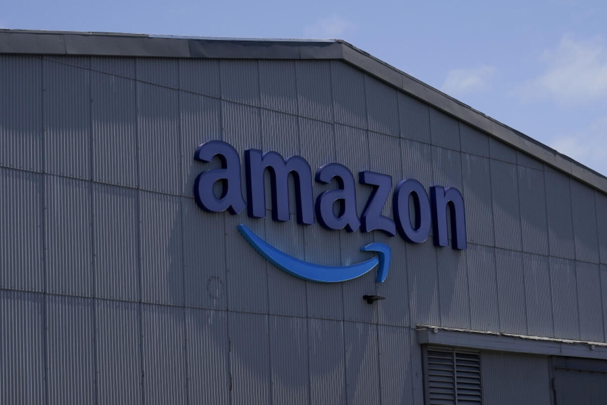 An Amazon sign is shown at a location in San Francisco, Thursday, May 25, 2023. Amazon, will launch vehicle sales in the U.S. next year and allow local car dealers to sell directly to customers on its site. In a joint announcement with car manufacturer Hyundai on Thursday, Nov. 16, the two companies said Amazon will begin by offering Hyundai vehicles.