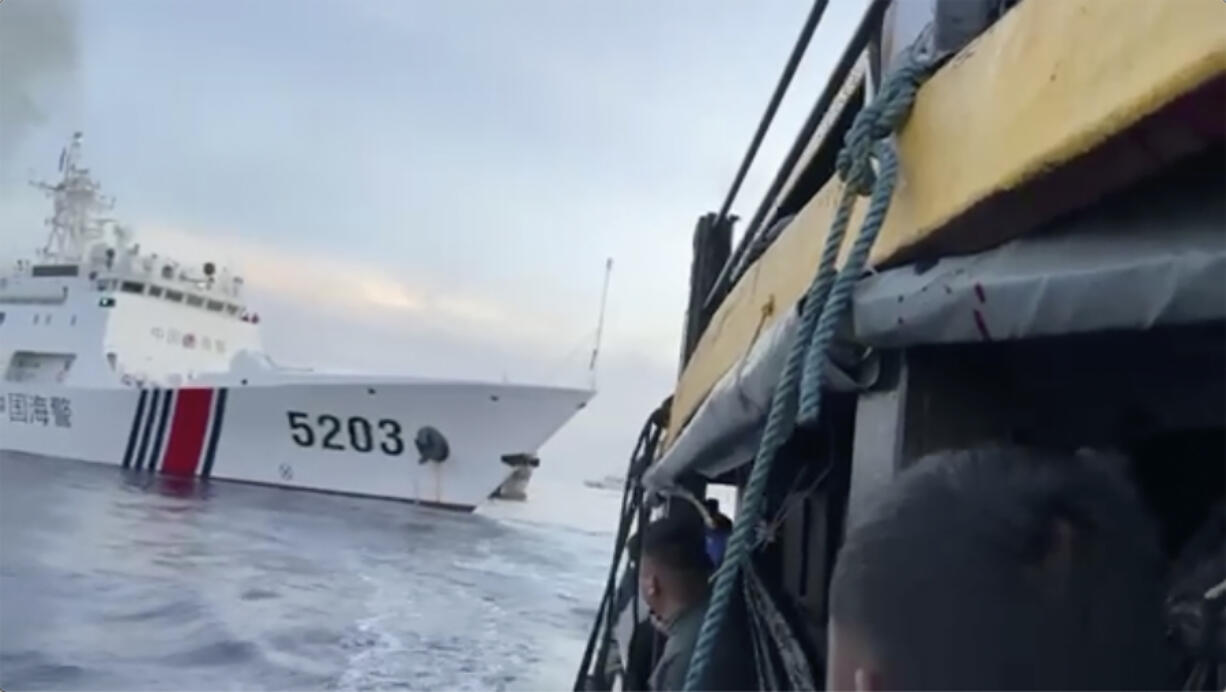 FILE - In this image from a video released by the Armed Forces of the Philippines, Filipino sailors look after a Chinese coast guard ship with bow number 5203 bumps their supply boat as they approach Second Thomas Shoal, locally called Ayungin Shoal, at the disputed South China Sea on Oct. 22, 2023. Chinese and Southeast Asian diplomats renewed a vow to finalize a nonaggression pact for the South China Sea in three years, two regional diplomats said Thursday, Nov. 2, 2023.