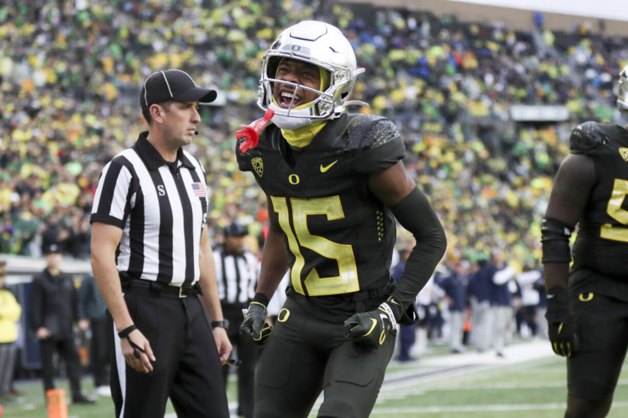 Oregon wide receiver Tez Johnson celebrates after scoring a touchdown against California during the first half of an NCAA football game, Saturday, Nov. 4, 2023, in Eugene, Ore.