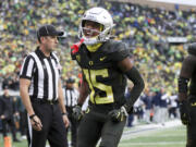 Oregon wide receiver Tez Johnson celebrates after scoring a touchdown against California during the first half of an NCAA football game, Saturday, Nov. 4, 2023, in Eugene, Ore.