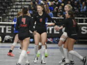 Camas players, from left, Emmah Sanchez, Avery Walunas, Ella Thompson and Mia Thorburn gather after a point against Curtis in the Class 4A state volleyball tournament on Saturday, Nov.