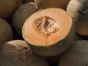 FILE - Cantaloupes are displayed for sale in Virginia on Saturday, July 28, 2017. U.S. health officials recalled three more brands of whole and pre-cut cantaloupes Friday, Nov. 24, 2023 as the number of people sickened by salmonella more than doubled this week.  (AP Photo/J.