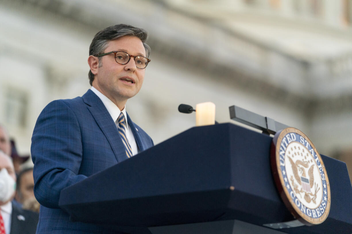 House Speaker Mike Johnson of Louisiana, speaks as members of Congress hold a candlelight vigil Tuesday for Israel on the steps of the U.S. House of Representatives.