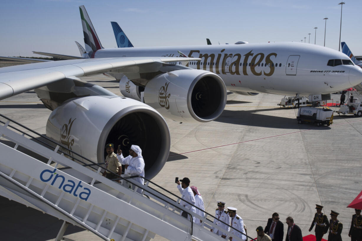 Visitors take photos at the Dubai Air Show in Dubai, United Arab Emirates, Monday, Nov. 13, 2023. Long-haul carrier Emirates opened the Dubai Air Show with a $52 billion purchase of Boeing Co. aircraft, showing how aviation has bounced back after the groundings of the coronavirus pandemic, even as Israel&rsquo;s war with Hamas clouds regional security.