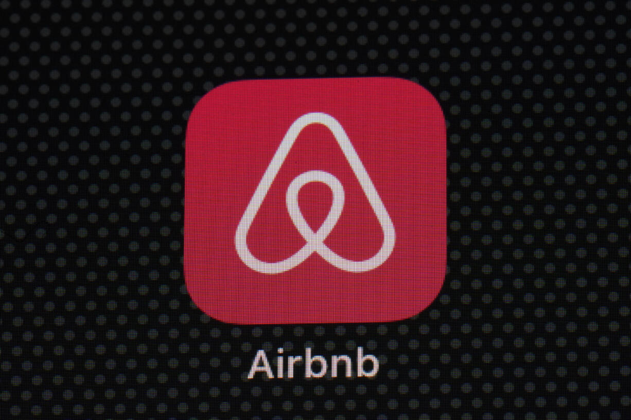 FILE - The Airbnb app icon is displayed on an iPad screen in Washington, D.C., on May 8, 2021. Airbnb reports earnings on Wednesday, Nov. 1, 2023.